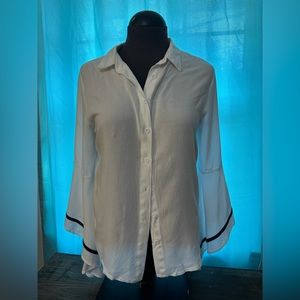 White button down blouse with flowing sleeve